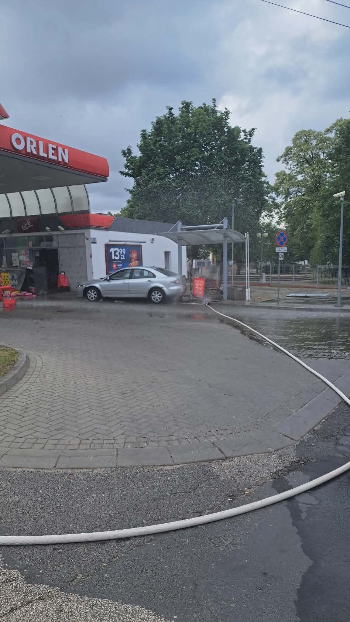 Fire hose line during operations at a damaged LPG dispenser in Mszczonów